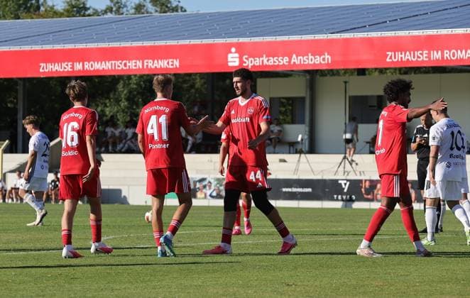 11.07.2026 - Fussball - Saison 2026 2027 - Testspiel Freundschaftsspiel Vorbereitungsspiel: SpVgg Ansbach 09 - 1. FC Nürnberg Nuernberg FCN ( Club ) - Sportfoto Zink DaMa - xdaxmax - Jubel Freude Torjubel nach Tor zum 1:2 - Eric Porstner (41, 1. FC Nürnberg FCN ) und Mannschaft Team jubelt freut sich - Torschütze: Eric Porstner (41, 1. FC Nürnberg FCN ) *** July 11, 2026 Soccer Season 2026–2027 Exhibition Match Friendly Match Preseason Match SpVgg Ansbach 09 vs. 1 FC Nürnberg (Nürnberg FCN) Club Sports Photo Zink DaMa xdaxmax Celebration Joy Goal Celebration after scoring the 1st goal 2 Eric Porstner 41, 1 FC Nürnberg FCN and the team celebrate, goal scorer Eric Porstner 41, 1 FC Nürnberg FCN
