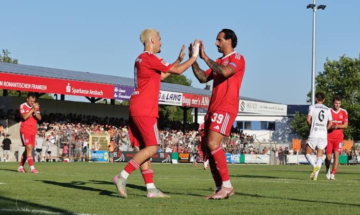 11.07.2026 - Fussball - Saison 2026 2027 - Testspiel Freundschaftsspiel Vorbereitungsspiel: SpVgg Ansbach 09 - 1. FC Nürnberg Nuernberg FCN ( Club ) - Sportfoto Zink DaMa - xdaxmax - Jubel Freude Torjubel nach Tor zum 1:4 - Sigurd Haugen ( 9, 1. FC Nürnberg FCN ) Adriano Grimaldi (39, 1. FC Nürnberg FCN ) jubelt freut sich - Torschütze: Sigurd Haugen ( 9, 1. FC Nürnberg FCN ) *** July 11, 2026 Soccer Season 2026–2027 Exhibition Match Friendly Match Preseason Match SpVgg Ansbach 09 vs. 1 FC Nürnberg Nuremberg FCN Club Sports Photo Zink DaMa xdaxmax Celebration Joy Goal Celebration after scoring the 1st goal 4 Sigurd Haugen 9, 1 FC Nürnberg FCN Adriano Grimaldi 39, 1 FC Nürnberg FCN celebrating, happy Goal scorer Sigurd Haugen 9, 1 FC Nürnberg FCN