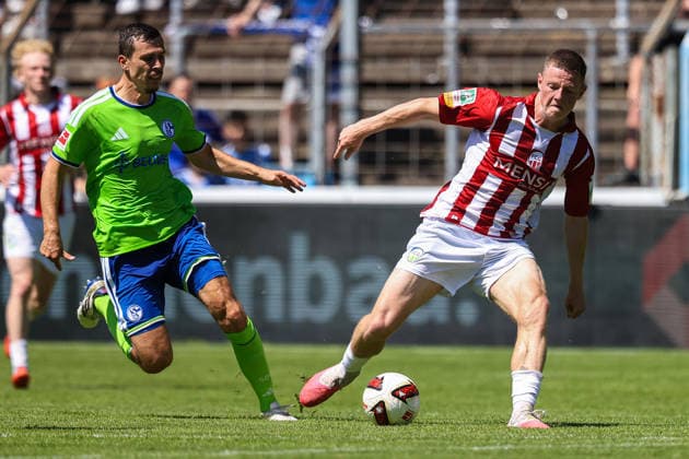 2026.07.11, xkwix, Fußball, Testspiel, FC Gütersloh - FC Schalke 04, NRG24 Stadion im Heidewald, Saison 2026 2027: Justin Lukas (FC Gütersloh 22) im Zweikampf gegen Ron Schallenberg (FC Schalke 04 6) DFB regulations prohibit any use of photographs as image sequences and or quasi-video. Photo: xKamilxWilkowskixPressefotoKochx Nordrhein-Westfalen Deutschland *** July 11, 2026, xkwix, soccer, friendly match, FC Gütersloh vs. FC Schalke 04, NRG24 Stadion im Heidewald, 2026–2027 season: Justin Lukas (FC Gütersloh 22) in a tackle against Ron Schallenberg (FC Schalke 04 6). DFB regulations prohibit any use of photographs as image sequences and or quasi-video. Photo: xKamilxWilkowskixPressefotoKochx, North Rhine-Westphalia, Germany