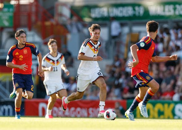 Wrexham, Wales, 11th July 2026. Otto Stange of Germany breaks forwards with the ball during the Spain U19 vs Germany U19 UEFA European U19 Championship Final match at The Racecourse, Wrexham. Picture credit should read: Cody Froggatt Sportimage EDITORIAL USE ONLY. No use with unauthorised audio, video, data, fixture lists, club league logos or live services. Online in-match use limited to 120 images, no video emulation. No use in betting, games or single club league player publications. SPI_027_CF_SPAIN_U19_V_GERMANY_U19_FINAL SPI-4858-0027
