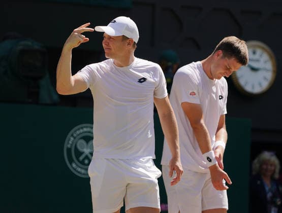 Tennis - 2026 Wimbledon Championships - Day Eleven (Week Two) - All England Lawn Tennis & Croquet Club, London - Saturday 11th July 2026 Mens Doubles Final : Henry Patten (GBR) and Harri Heliovaaran (FIN) v Marcelo Arevalo (ESA) and Mate Pavic (CRO) Henry Patten (GBR) and Harri Heliovaaran (FIN) - right, celebrate winning match point COLORSPORT ANDREW COWIE 