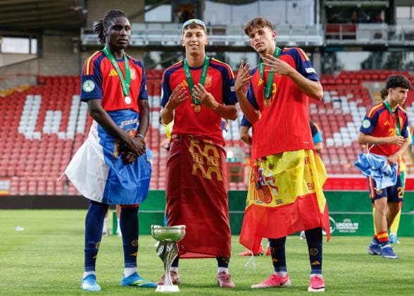 Wrexham, Wales, 11th July 2026. Left to right Ousmane Diallo, Hugo Lopez, Sergio Esteban of Spain pose with the UEFA European U19 Championship trophy following the Spain U19 vs Germany U19 UEFA European U19 Championship Final match at The Racecourse, Wrexham. Picture credit should read: Cody Froggatt Sportimage EDITORIAL USE ONLY. No use with unauthorised audio, video, data, fixture lists, club league logos or live services. Online in-match use limited to 120 images, no video emulation. No use in betting, games or single club league player publications. SPI_087_CF_SPAIN_U19_V_GERMANY_U19_FINAL SPI-4858-0087