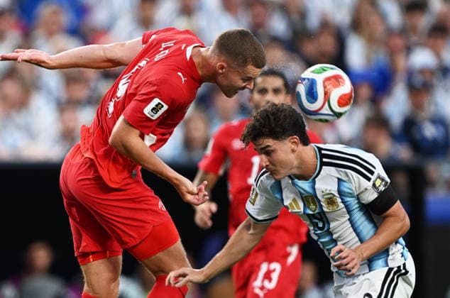 (260712) -- KANSAS CITY, July 12, 2026 -- Nico Elvedi (L) of Switzerland vies with Julian Alvarez of Argentina during the quarter final match between Argentina and Switzerland at the 2026 FIFA World Cup, WM, Weltmeisterschaft, Fussball at the Kansas City Stadium in Kansas City, the United States, July 11, 2026. ) (SP)U.S.-KANSAS CITY-FOOTBALL-FIFA WORLD CUP-QUARTER FINAL-ARG VS SUI XiaoxYijiu 