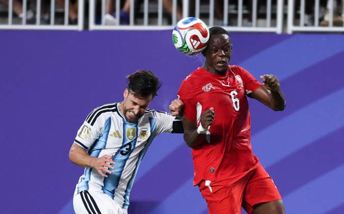 (260712) -- KANSAS CITY, July 12, 2026 -- Nicolas Tagliafico (L) of Argentina vies with Denis Zakaria of Switzerland during the quarter final match between Argentina and Switzerland at the 2026 FIFA World Cup, WM, Weltmeisterschaft, Fussball at the Kansas City Stadium in Kansas City, the United States, July 11, 2026. ) (SP)U.S.-KANSAS CITY-FOOTBALL-FIFA WORLD CUP-QUARTER FINAL-ARG VS SUI LixMing 