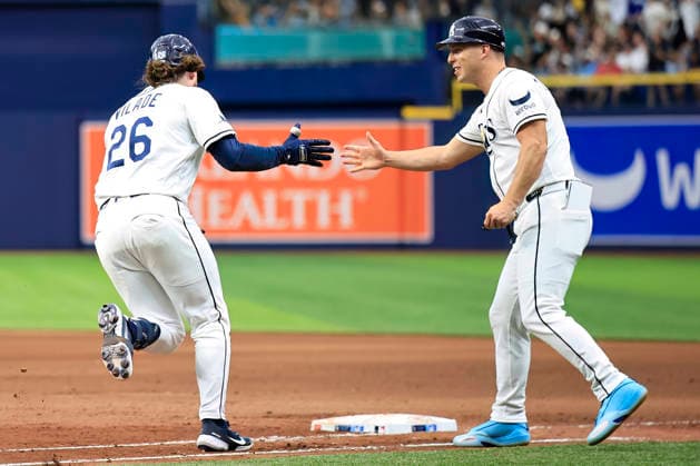 July 11, 2026, St. Petersburg, Florida, USA: Tampa Bay Rays right fielder Ryan Vilade (26) gets a high five from first base coach Corey Dickerson (10) after he hit a three run home run to left field during an MLB, Baseball Herren, USA game against the Seattle Mariners on July 11, 2026 at Tropicana Field. The Rays beat the Mariners 6-1. MLB 2026: Tampa Bay Rays 6 : 1 Seattle Mariners  - ZUMAh180 20260711_zsp_h180_081 Copyright: xKimxHukarix