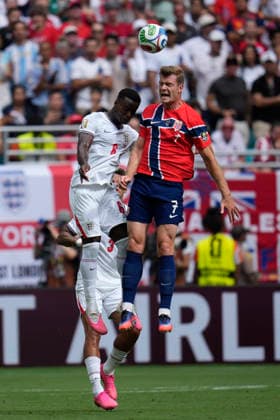 July 11, 2026, Miami Gardens, Florida, USA: Forward Alexander SoÂ¸rloth (7) of Norway and Defender Marc Guo hi (6) of England battle for a header during the quarterfinal match between England and Norway at Miami Stadium. England defeated Norway 2-1. World Cup 2026: Quarterfinal: England 2 : 1 Norway  - ZUMAd212 20260711_zsp_d212_013 Copyright: xRichardxDolex