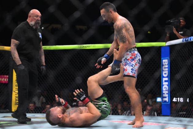 July 11, 2026, Las Vegas, Nevada, USA: MAX HOLLOWAY (top) defeated CONOR MCGREGOR (bottom) by TKO (knee injury) at 1:09 of Round 1 during UFC 329 at the T-Mobile Arena in Las Vegas. UFC 329: Max Holloway Defeated Conor McGregor By TKO  - ZUMAo117 20260711_zsp_o117_077 Copyright: xMikaelxOnax