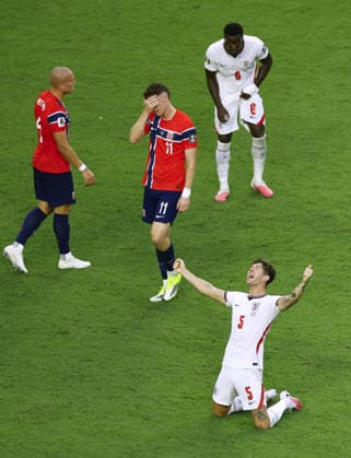 Football: 2026 World Cup England s John Stones (lower R) celebrates following a 2-1 victory over Norway in a World Cup quarterfinal football match at Miami Stadium in Miami Gardens, Florida, on July 11, 2026.  A14AA0005622715P