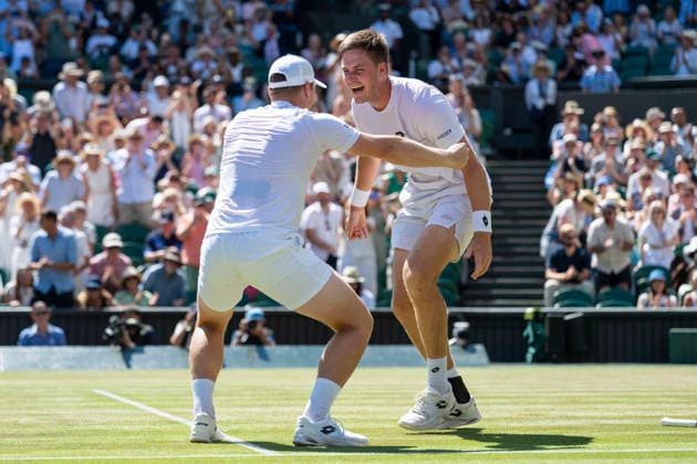 (260712) -- LONDON, July 12, 2026 -- Harri Heliovaara Henry Patten (R) celebrate winning the men s doubles final match between Harri Heliovaara (Finland) Henry Patten (Britain) and Marcelo Arevalo (El Salvador) Mate Pavic (Croatia) at the Wimbledon Tennis Championships in London, Britain, on July 11, 2026. (Photo by Xinhua) (SP)BRITAIN-LONDON-TENNIS-WIMBLEDON-MEN S DOUBLES StephenxChung 