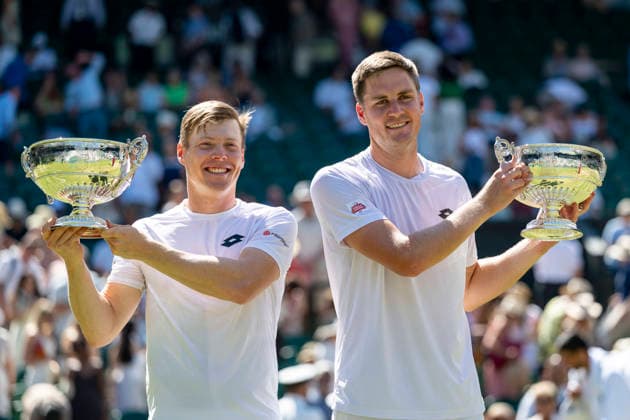 (260712) -- LONDON, July 12, 2026 -- Harri Heliovaara (L) Henry Patten pose with their trophies after winning the men s doubles final match between Harri Heliovaara (Finland) Henry Patten (Britain) and Marcelo Arevalo (El Salvador) Mate Pavic (Croatia) at the Wimbledon Tennis Championships in London, Britain, on July 11, 2026. (Photo by Xinhua) (SP)BRITAIN-LONDON-TENNIS-WIMBLEDON-MEN S DOUBLES StephenxChung 