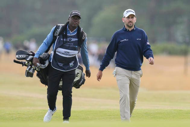 NORTH BERWICK, SCOTLAND - JULY 12: Nicolai Von Dellingshausen and his caddie Gina Bhembe walk up the 14th hole during the delayed Round 3 of the Genesis Scottish Open at the Renaissance Club, North Berwick on July 12, 2026 in North Berwick, Scotland Genesis Scottish Open Round 3