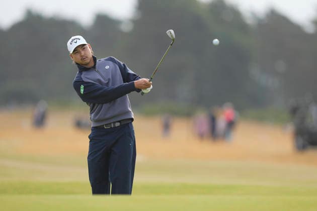 NORTH BERWICK, SCOTLAND - JULY 12: Min Woo Lee chips to the 14th green during the delayed Round 3 of the Genesis Scottish Open at the Renaissance Club, North Berwick on July 12, 2026 in North Berwick, Scotland Genesis Scottish Open Round 3