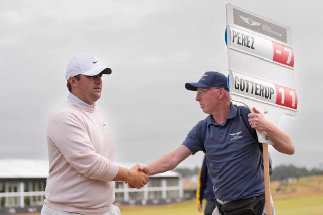 NORTH BERWICK, SCOTLAND - JULY 12: Chris Gotterup shakes hands with the scoreboard carrier after the delayed Round 3 of the Genesis Scottish Open at the Renaissance Club, North Berwick on July 12, 2026 in North Berwick, Scotland Genesis Scottish Open Round 3