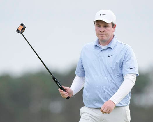 NORTH BERWICK, SCOTLAND - JULY 12: Robert MacIntyre reacts after holing a birdie putt on the 11th green during the delayed Round 3 of the Genesis Scottish Open at the Renaissance Club, North Berwick on July 12, 2026 in North Berwick, Scotland Genesis Scottish Open Round 3