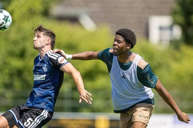SWOLGEN , 12-07-2026 , Sportpark Kerkebos , pre season 2026 2027 , Dutch Keukenkampioen divisie , football , friendly match between Top Oss and - MSV Duisburg , picture shows TOP Oss player Shedrach Ebite MSV Duisburg player Tobias Fleckstein Top Oss - MSV Duisburg (friendly)  x204994402x Copyright: