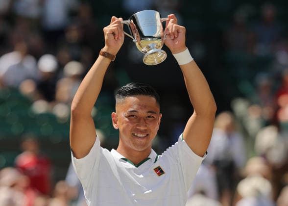 RECORD DATE NOT STATED 12th July 2026; All England Lawn Tennis and Croquet Club, London, England; Wimbledon Tennis Tournament, Final Day; Tokito Oda (JPN) lifts the Gentlemens Wheelchair Single trophy after defeating Alfie Hewett (GBR) JohnxPatrickxFletcher