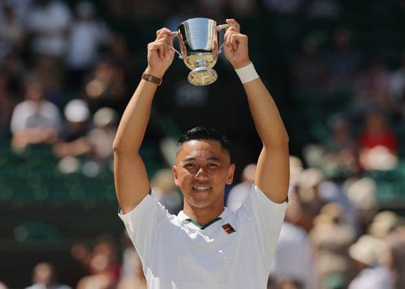 RECORD DATE NOT STATED 12th July 2026; All England Lawn Tennis and Croquet Club, London, England; Wimbledon Tennis Tournament, Final Day; Tokito Oda (JPN) lifts the Gentlemens Wheelchair Single trophy after defeating Alfie Hewett (GBR) JohnxPatrickxFletcher