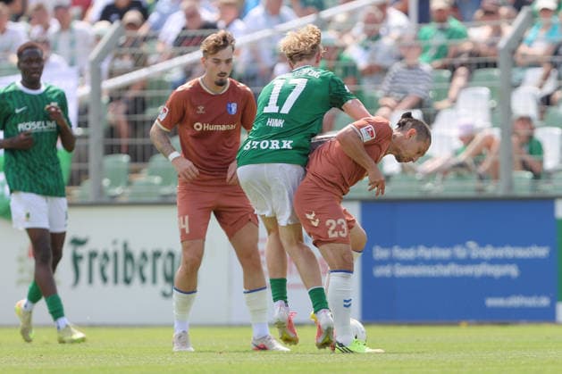 12.07.2026, xtgx, Fussball Testspiel, BSG Chemie Leipzig - 1. FC Magdeburg emspor, v.l. Hector Hink (Chemie) Baris Atik (Magdeburg, 23) Zweikampf, Duell, Kampf, tackle (DFL DFB REGULATIONS PROHIBIT ANY USE OF PHOTOGRAPHS as IMAGE SEQUENCES and or QUASI-VIDEO) Leipzig *** July 12, 2026, xtgx, soccer exhibition match, BSG Chemie Leipzig vs. 1. FC Magdeburg emspor, from left: Hector Hink (Chemie), Baris Atik (Magdeburg), 23 Tackle, duel, battle, DFL DFB REGULATIONS PROHIBIT ANY USE OF PHOTOGRAPHS as IMAGE SEQUENCES and or QUASI-VIDEO Leipzig