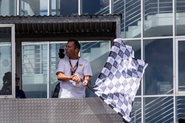 GER, Großer Preis von Deutschland, MotoGP. 11. Lauf, FIM Motorrad-Weltmeisterschaft. 12.07.2026, Sachsenring, Hohenstein-Ernstthal, GER, Großer Preis von Deutschland, MotoGP. 11. Lauf, FIM Motorrad-Weltmeisterschaft. Lothar Matthäus schwenkt die Zielflagge Â Foto: Alexander Trienitz Hohenstein-Ernstthal Sachsenring Sachsen Deutschland *** GER, German Grand Prix, MotoGP Round 11, FIM Motorcycle World Championship, July 12, 2026, Sachsenring, Hohenstein Ernstthal, GER, German Grand Prix, MotoGP Round 11, FIM Motorcycle World Championship Lothar Matthäus waves the checkered flag. Photo by Alexander Trienitz Hohenstein Ernstthal Sachsenring Saxony Germany