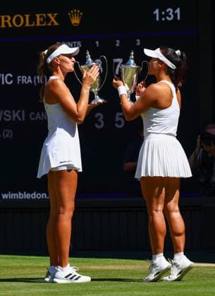 Hanyu Guo and Kristina Mladenovic celebrate victory in the Ladies Doubles Final Wimbledon Tennis Championships, Day 14, The All England Lawn Tennis and Croquet Club, London, UK - 12 Jul 2026London The All England Lawn Tennis and United Kingdom  Copyright: xJamesxMarsh Shutterstockx 16981035cr