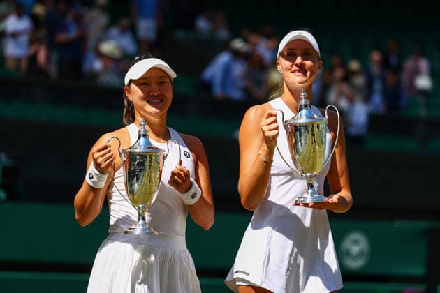 Hanyu Guo and Kristina Mladenovic celebrate victory in the Ladies Doubles Final Wimbledon Tennis Championships, Day 14, The All England Lawn Tennis and Croquet Club, London, UK - 12 Jul 2026London The All England Lawn Tennis and United Kingdom  Copyright: xJamesxMarsh Shutterstockx 16981035cv