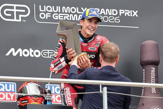Hohenstein-Ernstthal, 12.07.26: Motorrad Grand Prix Deutschland 2026, Sachsenring. Michael Kretschmer Ministerpräsident von Sachsen ueberreicht Marc Marquez (ESP) vom Ducati Lenovo Team den Pokal. Motorrad Grand Prix Germany 2025 *** Hohenstein Ernstthal, July 12, 2026—2026 German Motorcycle Grand Prix, Sachsenring: Michael Kretschmer, Minister President of Saxony, presents Marc Marquez (ESP) of the Ducati Lenovo Team with the 2025 German Motorcycle Grand Prix trophy.