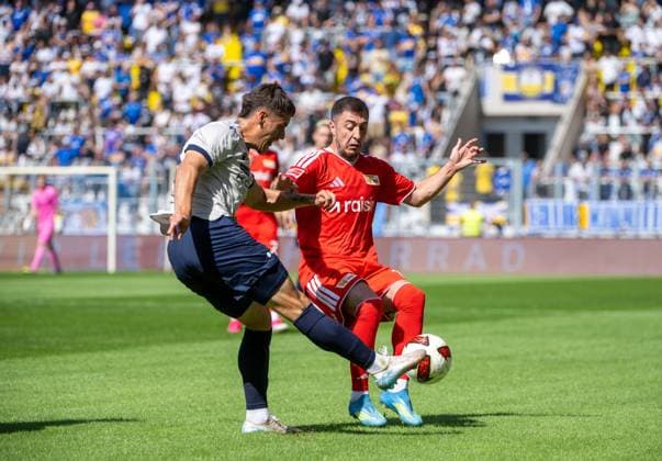 Fußball, Herren, Saison 2026 2027, Testspiel, FC Carl Zeiss Jena - 1. FC Union Berlin, v. l. Timon Burmeister (FC Carl Zeiss Jena), Josip Juranovic (1. FC Union Berlin), 12.07. 2026, *** Soccer, Men s, 2026–2027 Season, Friendly Match, FC Carl Zeiss Jena vs. 1. FC Union Berlin, from left: Timon Burmeister (FC Carl Zeiss Jena), Josip Juranovic (1. FC Union Berlin), July 12, 2026, Copyright: xMatthiasxKochx