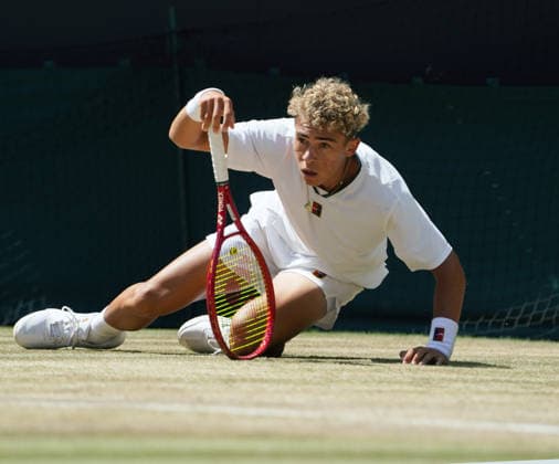 Tennis - 2026 Wimbledon Championships - Day Eleven (Week Two) - All England Lawn Tennis & Croquet Club, London - Sunday 12th July 2026 Court One - Boys singles Final Jordan Lee (USA) v Cruz Hewitt (AUS) Jordan Lee (USA) slips on the grass COLORSPORT ANDREW COWIE 