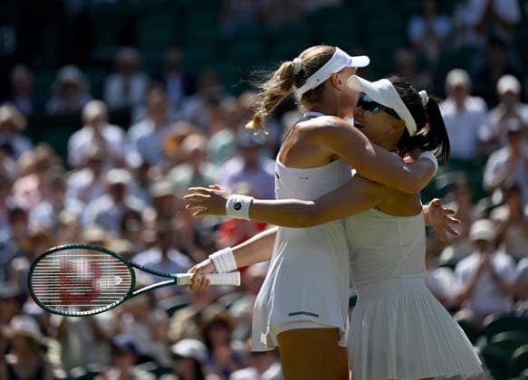 (260712) -- LONDON, July 12, 2026 -- Guo Hanyu (R) Kristina Mladenovic celebrate after winning the women s doubles final match between Guo Hanyu (China) Kristina Mladenovic (France) and Gabriela Dabrowski (Canada) Luisa Stefani (Brazil) at the Wimbledon Tennis Championships in London, Britain, on July 12, 2026. ) (SP)BRITAIN-LONDON-TENNIS-WIMBLEDON-WOMEN S DOULBES-FINAL LixYing 