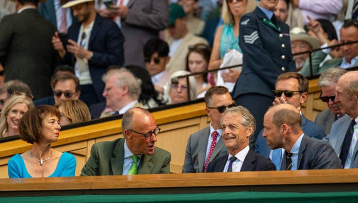 Tennis - Wimbledon Championship 2026 - Day 14 LONDON, ENGLAND - Sunday, July 12, 2026: (L-R) German Chancellor Friedrich Merz and his wife Charlotte Merz chat with former hockey player Mark Precious and William Windsor (aka Prince of Wales) during the Gentlemen s Singles Final match on Day Fourteen of The Championships Wimbledon 2026 at the All England Lawn Tennis and Croquet Club. (Photo by Kirsten Holst Propaganda) LONDON All England Lawn Tennis and Croq GREATER LONDON ENGLAND  Copyright: xKirstenxHolstx 2026-07-12-017-Wimbledon_Day_14