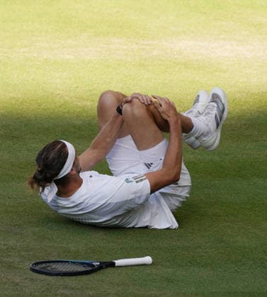 Tennis - 2026 Wimbledon Championships - Day Eleven (Week Two) - All England Lawn Tennis & Croquet Club, London - Sunday 12th July 2026 Centre Court - Mens singles Final Jannik Sinner (ITA) v Alexander Zverev (GER) Alexander Zverev (GER) slips on the grass COLORSPORT ANDREW COWIE 