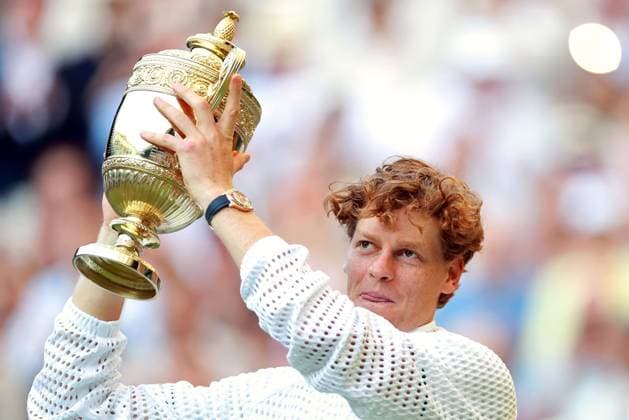 Jannik Sinner celebrates with the trophy after victory in the Men s Singles final Wimbledon Tennis Championships, Day 14, The All England Lawn Tennis and Croquet Club, London, UK - 12 Jul 2026London The All England Lawn Tennis and United Kingdom  Copyright: xJamesxMarsh Shutterstockx 16981035iq