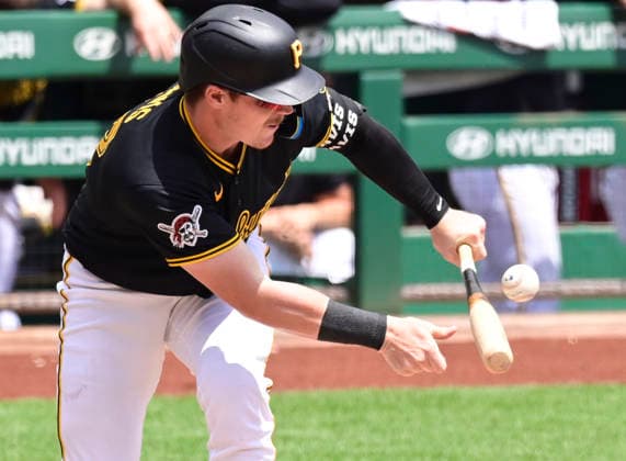 Pittsburgh Pirates catcher Henry Davis (32) attempts a bunt and followups up with a home run tp left during the second inning against the Milwaukee Brewers at PNC Park on Sunday, July 12, 2026 in Pittsburgh.  PIT2026071212 ArchiexCarpenter