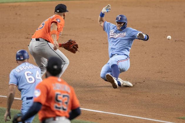 July 12, 2026, Arlington, Texas, USA: Texas Rangers third baseman JOSH JUNG (6) slides safely into third base after hitting a triple during a MLB, Baseball Herren, USA game between the Houston Astros and Texas Rangers at Globe Life Field. Rangers win 6-5. MLB 2026: Rangers 6:5 Astros  - ZUMAf180 20260712_zsp_f180_013 Copyright: xMarkxFannx