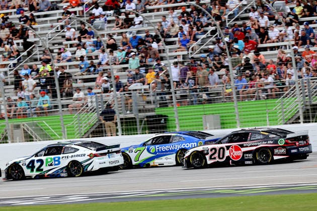 HAMPTON, GA - JULY 12: 42 John Hunter Nemechek, LEGACY MOTOR CLUB, Pye-Barker Fire & Safety Toyota Camry leads 7 Daniel Su‡rez, Spire Motorsports, Freeway Insurance Chevrolet Camaro and 20 Christopher Bell, Joe Gibbs Racing, Rheem Toyota Camry during the NASCAR, Motorsport, USA Cup Series Quaker State 400 race on July 12, 2026 at EchoPark Speedway in Hampton, Georgia. (Photo by David J. Griffin Icon Sportswire) AUTO: JUL 12 NASCAR Cup Series Quaker State 400 EDITORIAL USE ONLY Icon9532607121668