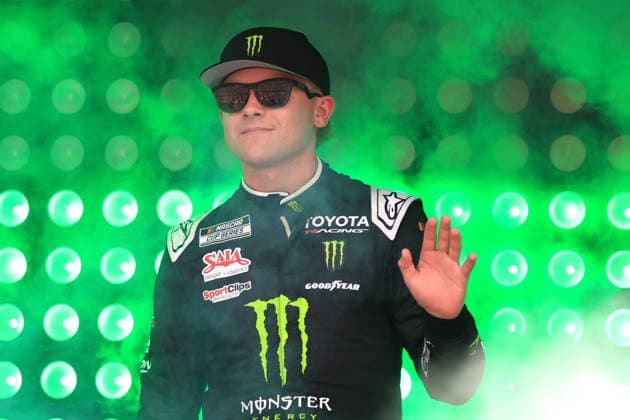 ATLANTA, GA - JULY 12: Ty Gibbs ( 54 Joe Gibbs Racing Monster Energy Toyota) waves to the crowd during driver introductions prior to the running of the NASCAR, Motorsport, USA Cup Series Quaker State 400 on July 12, 2026 at EchoPark Speedway in Hampton, GA. (Photo by Jeff Robinson Icon Sportswire) AUTO: JUL 12 NASCAR Cup Series Quaker State 400 EDITORIAL USE ONLY Icon26071212048400