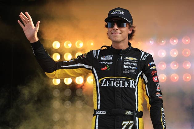 ATLANTA, GA - JULY 12: Carson Hocevar ( 77 Spire Motorsports Zeigler Auto Group Chevrolet) waves to the crowd during driver introductions prior to the running of the NASCAR, Motorsport, USA Cup Series Quaker State 400 on July 12, 2026 at EchoPark Speedway in Hampton, GA. (Photo by Jeff Robinson Icon Sportswire) AUTO: JUL 12 NASCAR Cup Series Quaker State 400 EDITORIAL USE ONLY Icon26071212292400