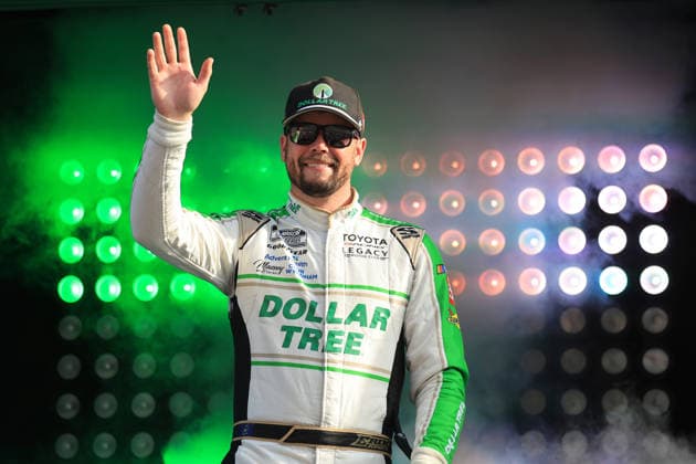 ATLANTA, GA - JULY 12: Erik Jones ( 43 Legacy Motor Club Dollar Tree ) waves to the crowd during driver introductions prior to the running of the NASCAR, Motorsport, USA Cup Series Quaker State 400 on July 12, 2026 at EchoPark Speedway in Hampton, GA. (Photo by Jeff Robinson Icon Sportswire) AUTO: JUL 12 NASCAR Cup Series Quaker State 400 EDITORIAL USE ONLY Icon26071212439400