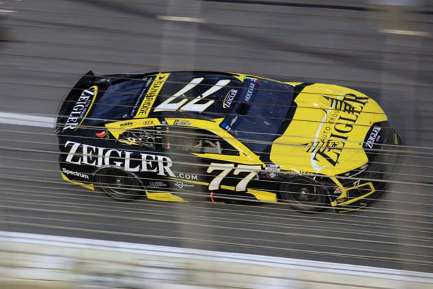 ATLANTA, GA - JULY 12: Carson Hocevar ( 77 Spire Motorsports Zeigler Auto Group Chevrolet) races into the tri-oval during the running of the NASCAR, Motorsport, USA Cup Series Quaker State 400 on July 12, 2026 at EchoPark Speedway in Hampton, GA. (Photo by Jeff Robinson Icon Sportswire) AUTO: JUL 12 NASCAR Cup Series Quaker State 400 EDITORIAL USE ONLY Icon26071213623400