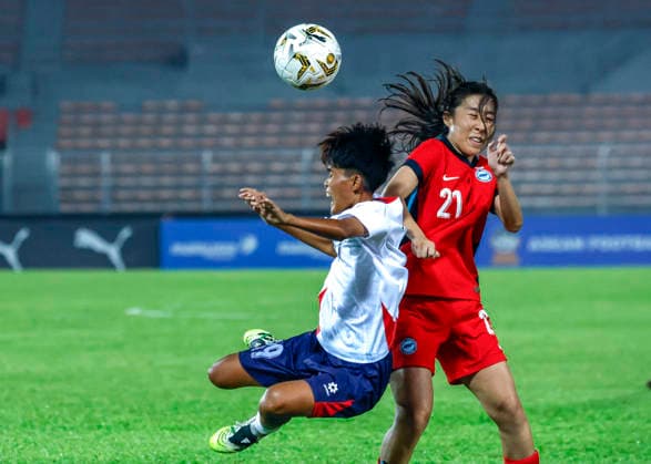 July 13, 2026, Kuala Lumpur, Malaysia: Venetia Lim of Singapore (R) and Anouta Chanthithong of Laos seen in action during the AFF Women s Cup 2026 match between Singapore and Laos at Kuala Lumpur Football Stadium, Cheras. Final score Singapore 1 : 1 Laos AFF Women s Cup 2026 Singapore Vs Laos In Kuala Lumpur, Malaysia - 13 Jul 2026  - ZUMAs197 20260713_aaa_s197_214 Copyright: xWongxFokxLoyx