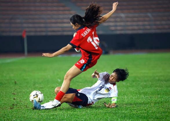 July 13, 2026, Kuala Lumpur, Malaysia: Nur Sarah of Singapore (L) and Saysamone Inthaphone of Laos seen in action during the AFF Women s Cup 2026 match between Singapore and Laos at Kuala Lumpur Football Stadium, Cheras. Final score Singapore 1 : 1 Laos AFF Women s Cup 2026 Singapore Vs Laos In Kuala Lumpur, Malaysia - 13 Jul 2026  - ZUMAs197 20260713_aaa_s197_216 Copyright: xWongxFokxLoyx