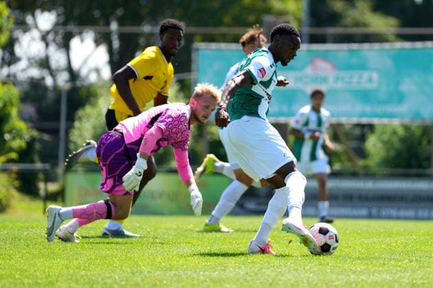 Friendly: FC Dordrecht v Borussia Dortmund II Papendrecht - Beni Mpanzu of FC Dordrecht dribbles past Goalkeeper Aaron Held of Borussia Dortmund II during a friendly match in preperation of the 2026 2027 season. The match is set between FC Dordrecht and Borussia Dortmund II at V.V. Papendrecht on 14 July 2026 in Papendrecht, The Netherlands. (Hero Images Nick Koole) Copyright: xNickxKoolex