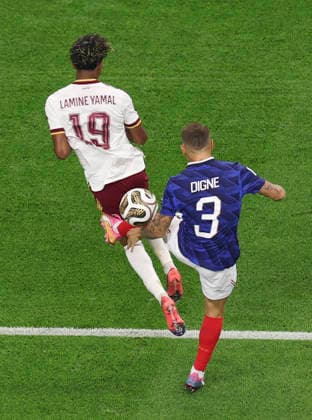 (260715) -- DALLAS, July 15, 2026 -- Lucas Digne (R) of France fouls Lamine Yamal of Spain during the semifinal match between France and Spain at the 2026 FIFA World Cup, WM, Weltmeisterschaft, Fussball at Dallas Stadium in Dallas, the United States, July 14, 2026. ) (SP)U.S.-DALLAS-FOOTBALL-FIFA WORLD CUP-SEMIFINAL-FRA VS ESP HuxXingyu 