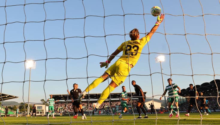 UEFA Champions League First Qualifying Round Second Leg, Tallaght Stadium, Dublin 14 7 2026 Shamrock Rovers vs Floriana Floriana™s Guilherme Cioletti dives to make a save from Dylan Watts of Rover Guilherme Cioletti dives to make a save from Dylan Watts 14 7 2026  Copyright: xx JCA18948