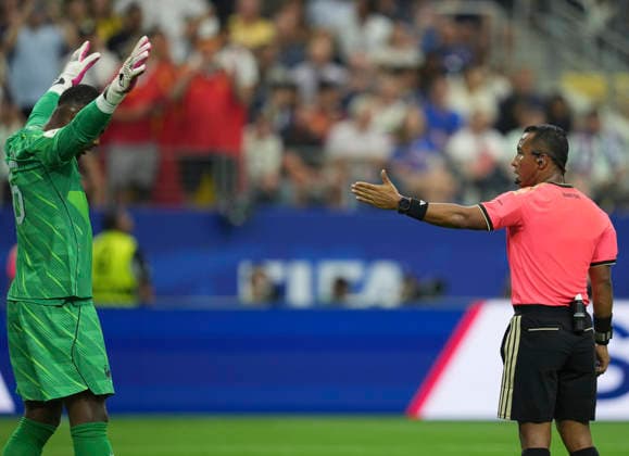 (260715) -- DALLAS, July 15, 2026 -- Referee Ivan Barton (R) gestures during the semifinal match between France and Spain at the 2026 FIFA World Cup, WM, Weltmeisterschaft, Fussball at Dallas Stadium in Dallas, the United States, July 14, 2026. ) (SP)U.S.-DALLAS-FOOTBALL-FIFA WORLD CUP-SEMIFINAL-FRA VS ESP WuxXiaoling 