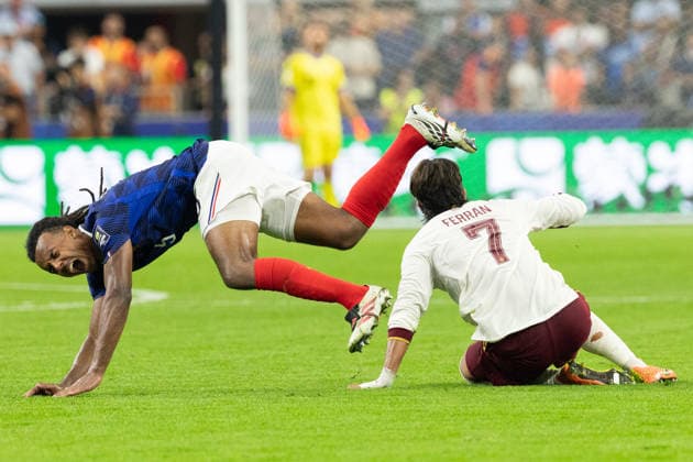 July 14, 2026, Arlington, Texas, USA: France defender JULES KOUNDE (5) trips over Spain midfielder FERRAN TORRES (7) during a 2026 FIFA World Cup, WM, Weltmeisterschaft, Fussball semifinal match between France and Spain at Dallas Stadium in Arlington, Texas. Spain defeated France, 2-0. World Cup 2026: Semifinal: Spain 2:0 France  - ZUMAh193 20260714_zsp_h193_074 Copyright: xDanielxMcGregor-Huyerx