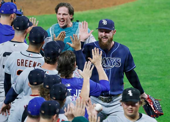 American League closing pitcher Bryan Baker and catcher Adley Rutschman celebrate with teammates after defeating the National League 4-0 in the 2026 MLB, Baseball Herren, USA All-Star Game at Citizens Bank Park in Philadelphia, Pennsylvania, on Tuesday, July 14, 2026.  PHI20260714956 LAURENCExKESTERSON