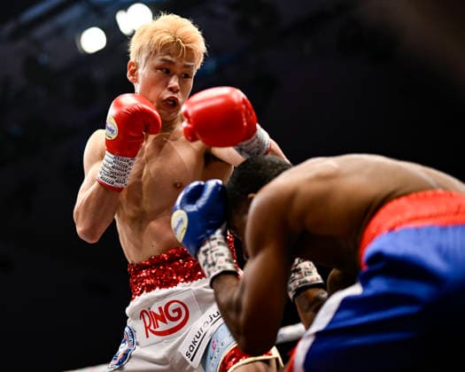 Hayato Tsutsumi (red gloves) of Japan and Felix Batista (blue gloves) of Dominican Republic compete during their WBA Super Featherweight Title Eliminator boxing bout at Korakuen Hall in Tokyo, Japan, July 14, 2026. Noxthirdxpartyxsales  aflo_338074463 HIROAKIxFINITOxYAMAGUCHIx