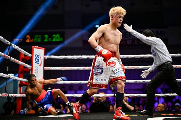 Hayato Tsutsumi (red gloves) of Japan knocks down Felix Batista (blue gloves) of Dominican Republic during their WBA Super Featherweight Title Eliminator boxing bout at Korakuen Hall in Tokyo, Japan, July 14, 2026. Noxthirdxpartyxsales  aflo_338074472 HIROAKIxFINITOxYAMAGUCHIx