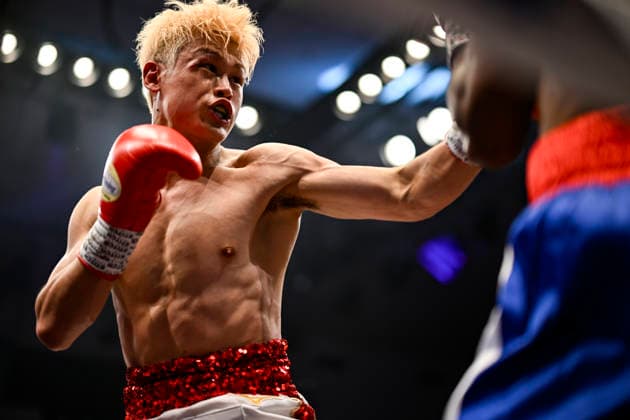 Hayato Tsutsumi (red gloves) of Japan and Felix Batista (blue gloves) of Dominican Republic compete during their WBA Super Featherweight Title Eliminator boxing bout at Korakuen Hall in Tokyo, Japan, July 14, 2026. Noxthirdxpartyxsales  aflo_338074475 HIROAKIxFINITOxYAMAGUCHIx